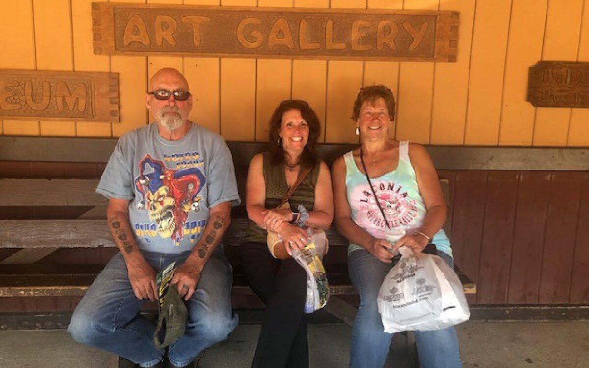 Charlie and Ann McLaughlin with family friend, Doreen, in the middle, sitting outside of the iconic 76,000-square-foot Wall Drug Store. (Salena Zito)