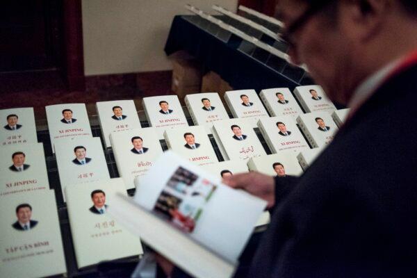 Chinese leader Xi Jinping's book, translated into foreign languages, is on display at the Great Hall of the People in Beijing on Dec. 1, 2017. (Fred Dufour/AFP)