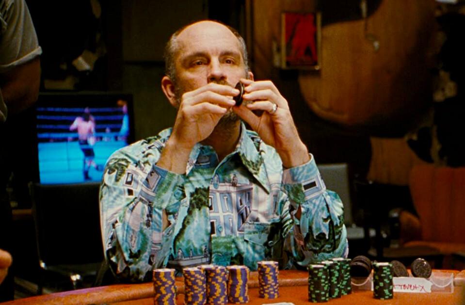 Teddy KGB (John Malkovich) is unaware that he's displaying his poker "tell," in "Rounders." (Miramax)