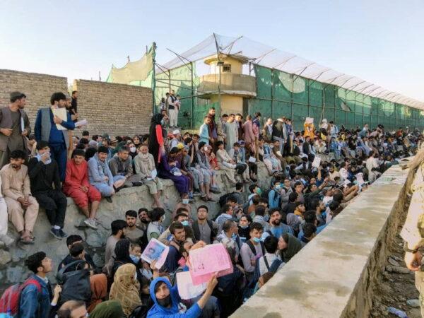 In this picture obtained from social media, crowds of people wait outside the airport in Kabul, Afghanistan, on Aug. 25, 2021. (David_Martinon/Twitter via Reuters)