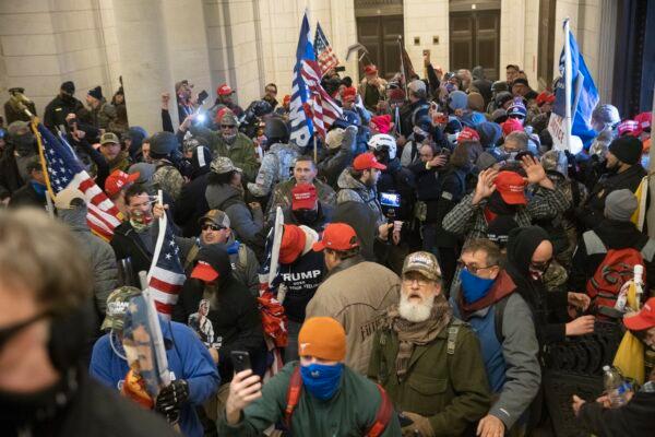 Protesters supporting U.S. President Donald Trump gather near the east front door of the U.S. Capitol after groups breached the building's security in Washington on Jan. 6, 2021. (Win McNamee/Getty Images)