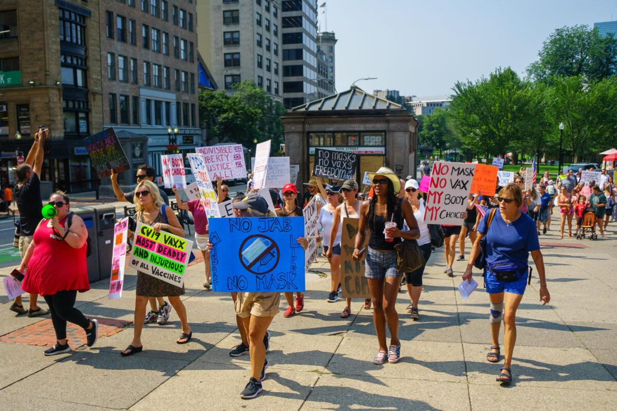 Protesters marched to the Massachusetts Department of Public Health in Boston, Mass., on Aug 25, 2021. (Learner Liu/The Epoch Times)