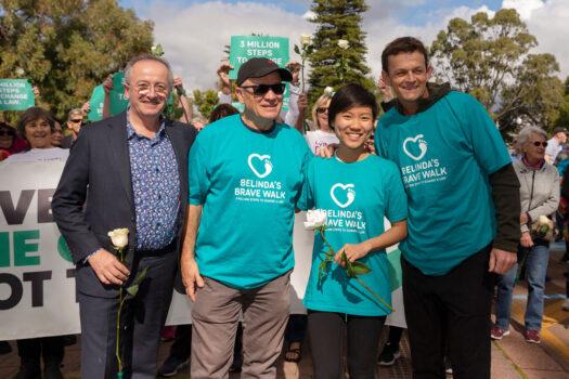 (L-R) TV presenter Andrew Denton, cricket player Adam Gilchrist, Belinda Teh, cricket coach Ric Charlesworth at Kings Park before walking on to the WA Parliament with euthanasia advocates in Perth, Australia, on Aug. 6, 2019. (Will Russell/Getty Images)