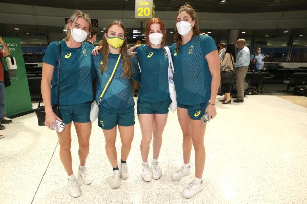 Australian Olympians (L to R) Kiah Melverton, Chelsea Hodges, Mollie O'Callaghan and Meg Harris pose for a photo at Brisbane Airport after undergoing 14 days of mandatory quarantine at Howard Springs in the Northern Territory, in Brisbane, Australia, on Aug. 17, 2021. (Jono Searle/Getty Images)