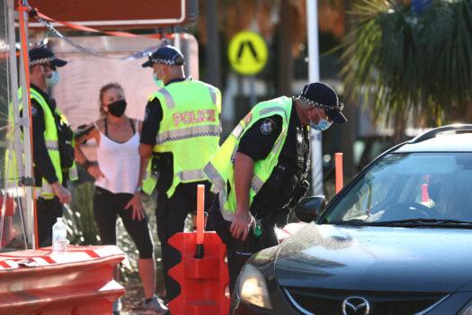 Queensland Police stop cars in Griffith street Coolangatta at the Queensland border in Coolangatta, Australia, on Aug. 25, 2021. (Chris Hyde/Getty Images)