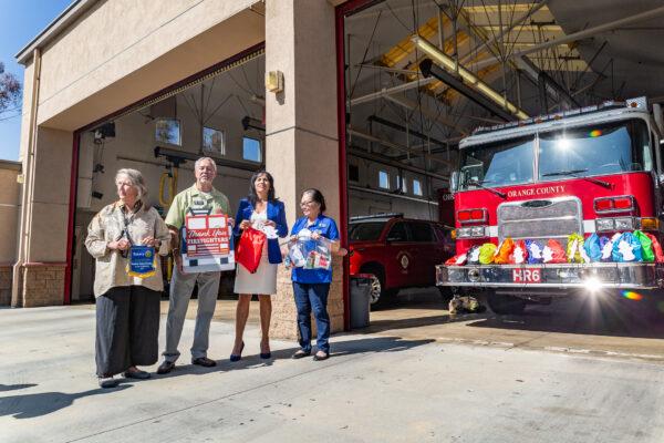 Members of the Rotary Club of Irvine present gift bags to OCFA firefighters in Irvine, Calif., on Aug. 26, 2021. (John Fredricks/The Epoch Times)