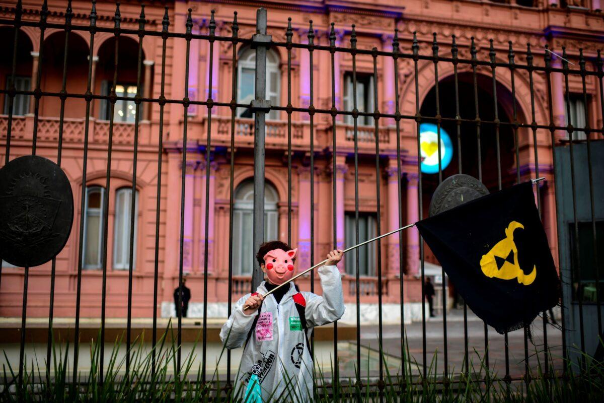A demonstrator takes part in a protest against an agreement between Argentina and China to produce and export pork, in front of Casa Rosada Presidential Palace in Buenos Aires, Argentina, on Aug. 31, 2020. (Ronaldo Schemidt/AFP via Getty Images)