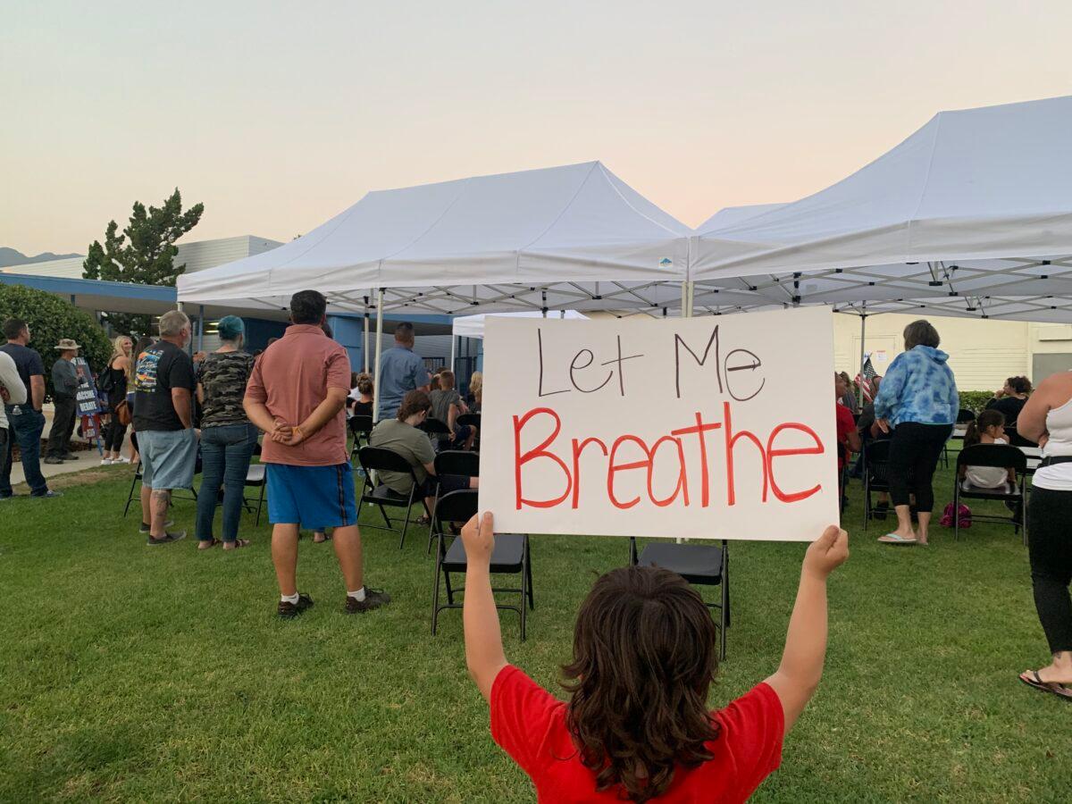 Dozens of parents protest against the district's mask mandate during a meeting of the Glendora Unified School District at Sellers Elementary School in Glendora, Los Angeles County, on Aug. 23, 2021. (Linda Jiang/The Epoch Times)