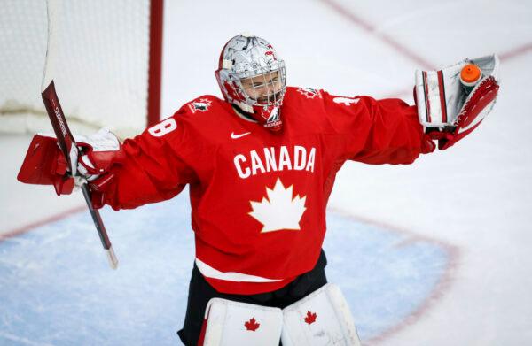 Canada's goalie Emerance Maschmeyer celebrates after defeating Germany during quarterfinal IIHF Women's World Championship hockey action in Calgary, on Aug. 28, 2021. (Jeff McIntosh/The Canadian Press via AP)