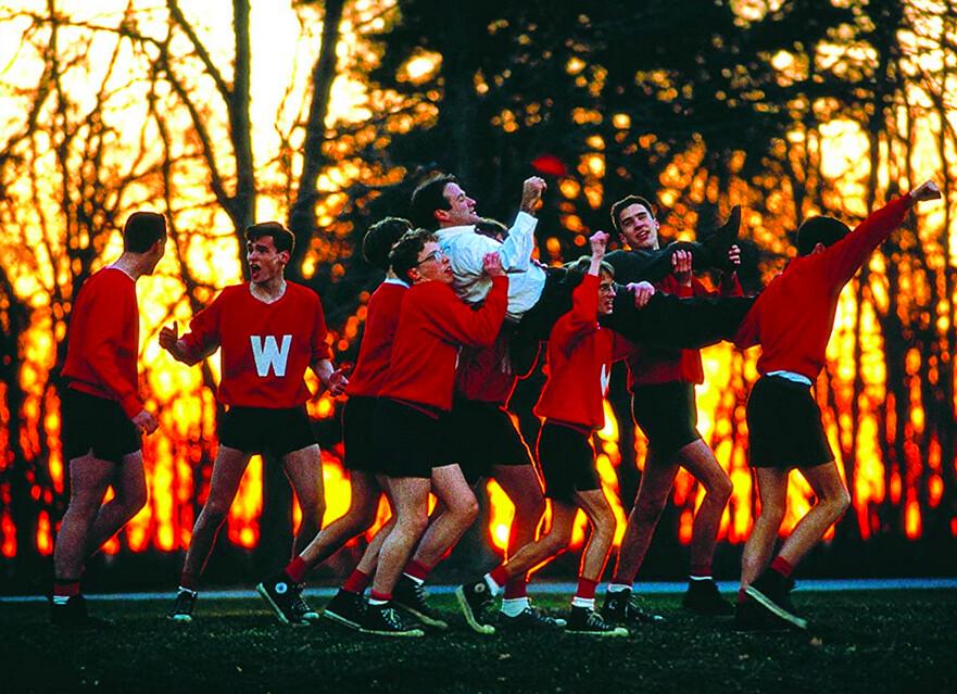 Mr. Keating (Robin Williams) is celebrated by his students, whom he has inspired to "seize the day," in "Dead Poets Society." (Touchstone Pictures/Warner Bros)