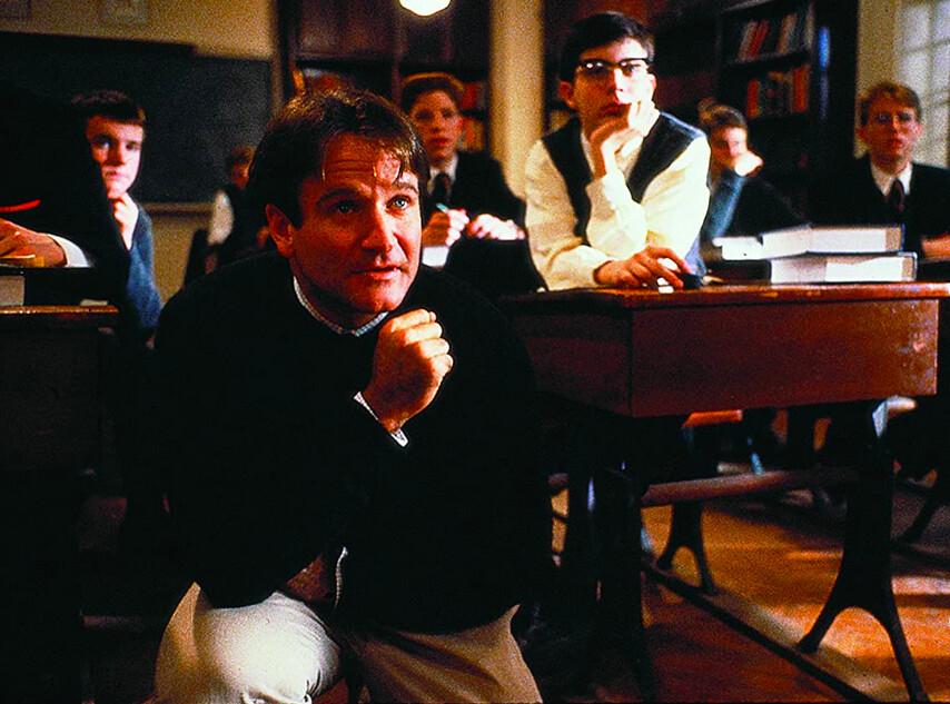 John Keating (Robin Williams) taking a knee in his English class, in "Dead Poets Society." (Touchstone Pictures/Warner Bros)