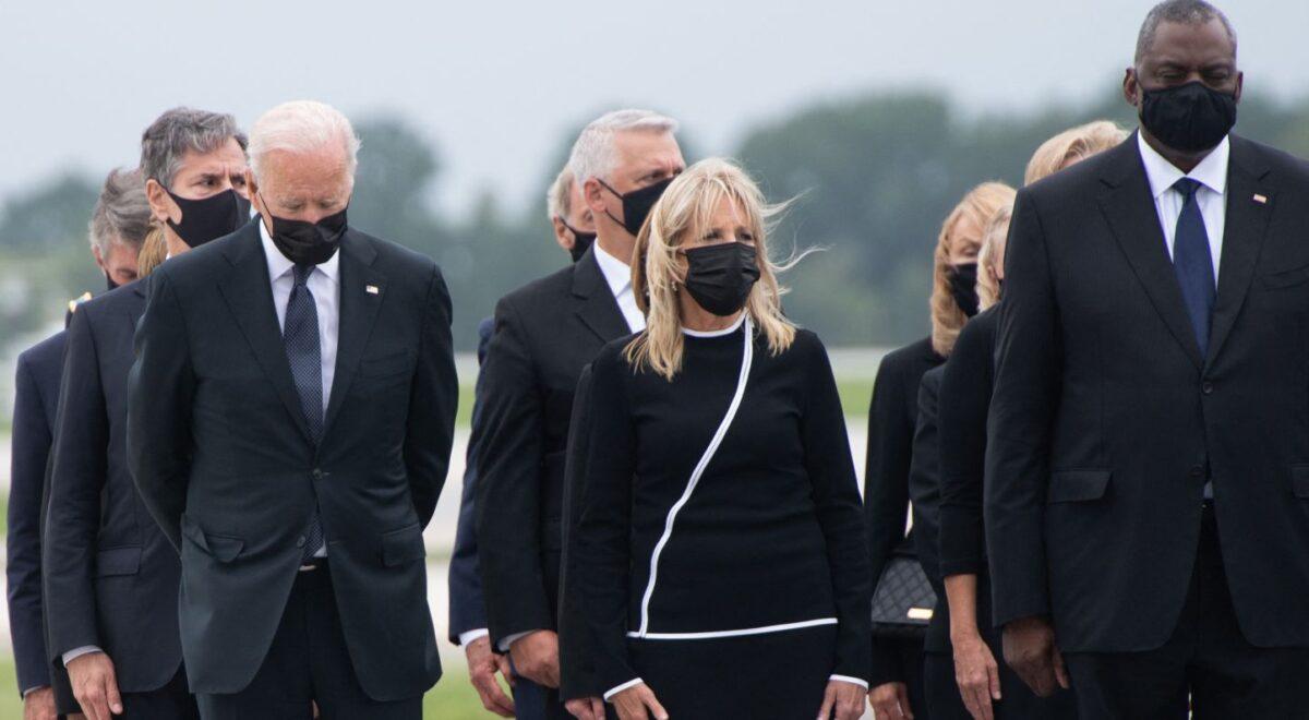 President Joe Biden, First Lady Jill Biden, Secretary of Defense Lloyd Austin, and other officials attend the dignified transfer of the remains at Dover Air Force Base in Dover, Del., on Aug. 29, 2021, (Saul Loeb/AFP via Getty Images)