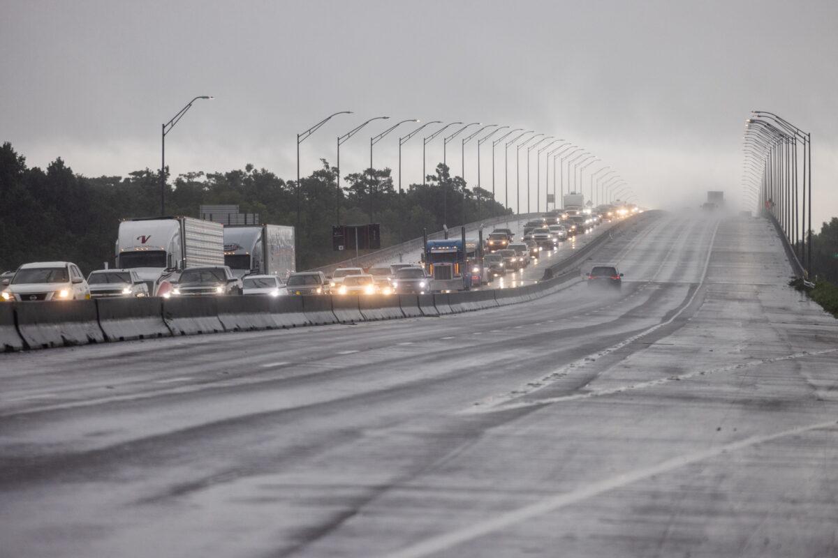 Traffic moves bumper to bumper along I-10 west as residents arrive into Texas from the Louisiana border ahead of Hurricane Ida in Orange, Texas, on Aug. 28, 2021. (Adrees Latif/Reuters)