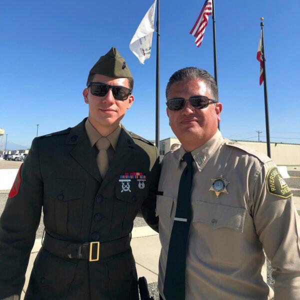 U.S. Marine Corps Cpl. Hunter Lopez (L) with his father Capt. Herman Lopez in Riverside, Calif. in an undated photo. (Riverside County Sheriff's Department via AP)