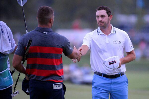 Patrick Cantlay (R) shakes hands with Bryson DeChambeau after Cantlay won their sixth playoff hole of the final round of the BMW Championship golf tournament, at Caves Valley Golf Club in Owings Mills, Md., on Aug. 29, 2021. (Nick Wass/AP Photo)