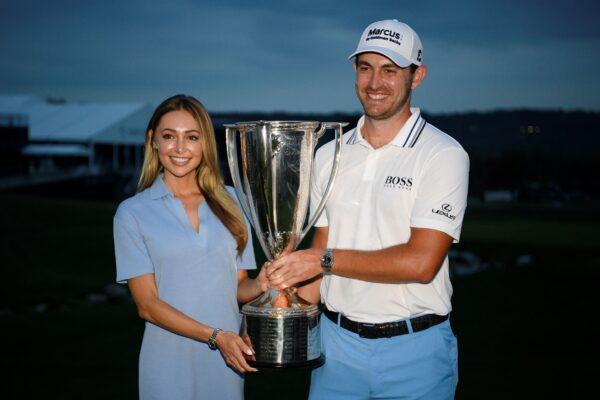 Patrick Cantlay (R) poses with his girlfriend, Nikki Guidish and the FedEx Cup after he won the BMW Championship golf tournament, at Caves Valley Golf Club in Owings Mills, Md., on Aug. 29, 2021. (Nick Wass/AP Photo)