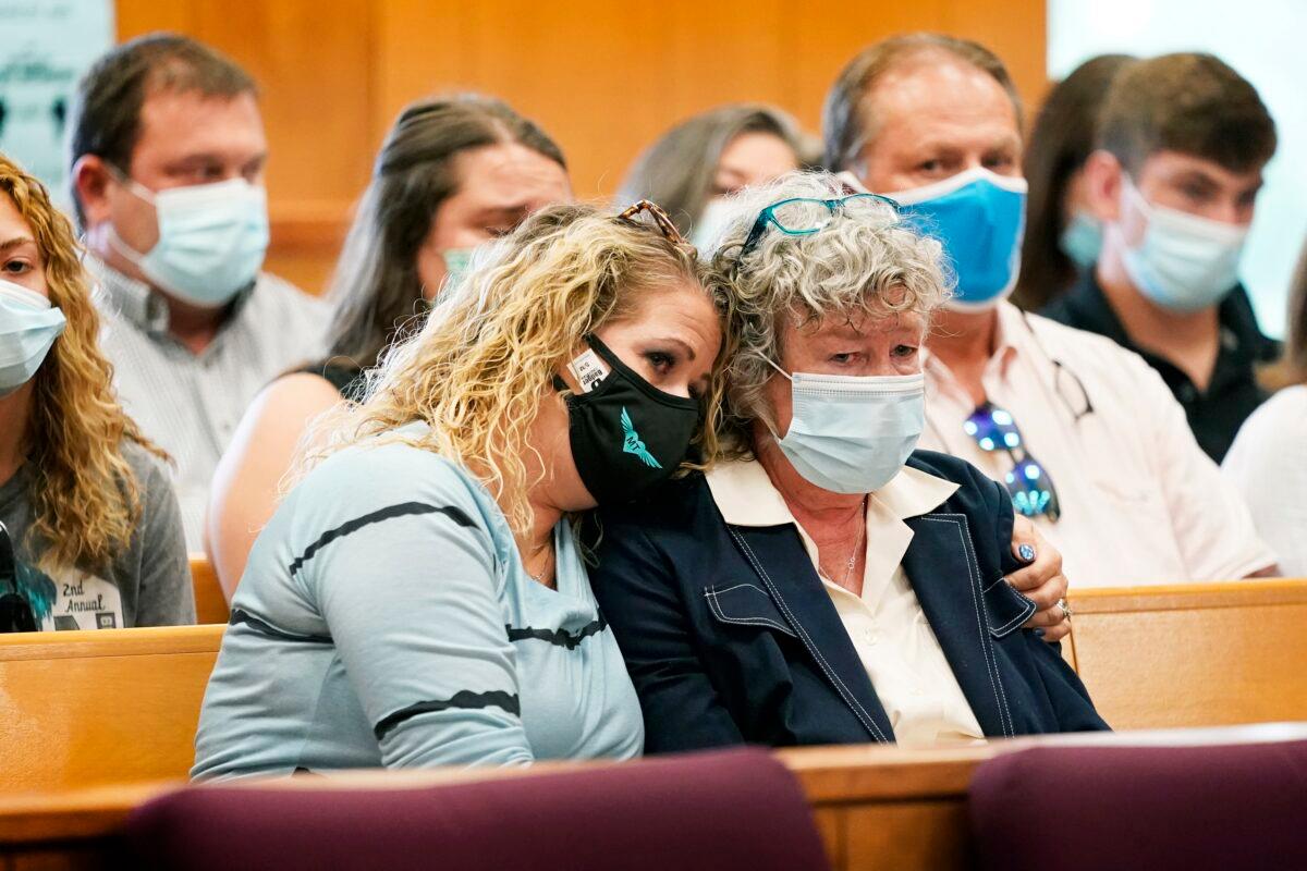 Laura Calderwood (R), mother of Mollie Tibbetts, is comforted as her victim impact statement is read during a sentencing hearing for Cristhian Bahena Rivera at the Poweshiek County Courthouse in Montezuma, Iowa, on Aug. 30, 2021. (Charlie Neibergall/Pool/AP Photo)