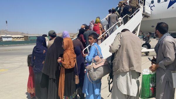 Department of State Representatives move with haste loading American citizens onto Ark Salus Boing 737s, the special private air carrier to Ark Salus at Hamid Karzai International Airport on Aug. 22, 2021. (Courtesy of Ark Salus)