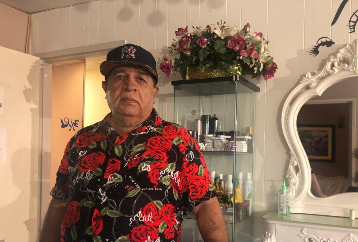 Fakhrudin Fakhrudin at his workplace in an Indian beauty salon in Hicksville, Long Island, on Aug. 30, 2021. (Enrico Trigoso/The Epoch Times)