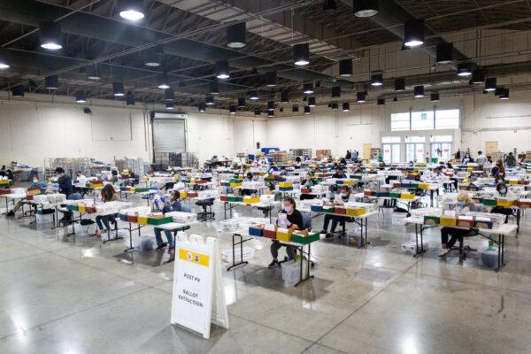 People count California recall ballot votes at a Los Angeles Registrar site at the Los Angeles Fair Grounds in Pomona, Calif., on Aug. 31, 2021. (John Fredricks/The Epoch Times)
