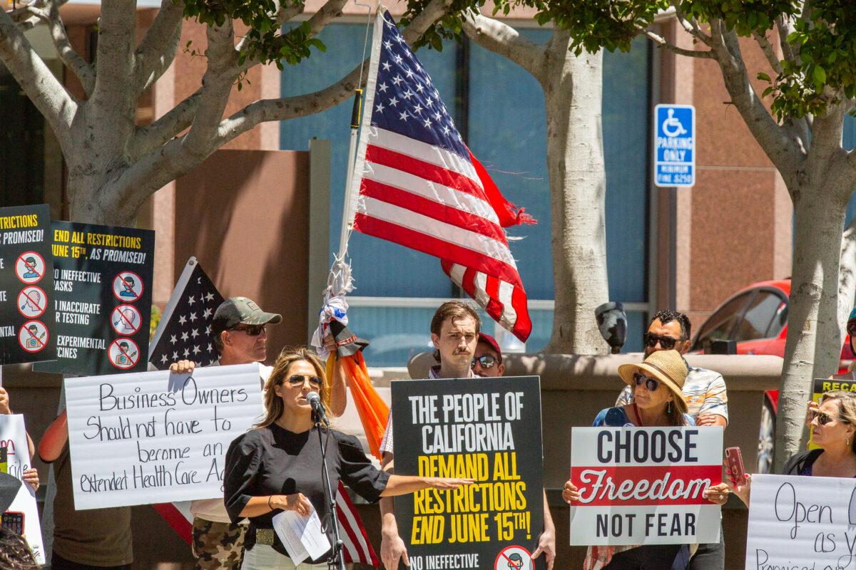  Demonstrators gather to protest COVID-19 restrictions by Cal/OSHA in Santa Ana, Calif., on June 10, 2021. (John Fredricks/The Epoch Times)