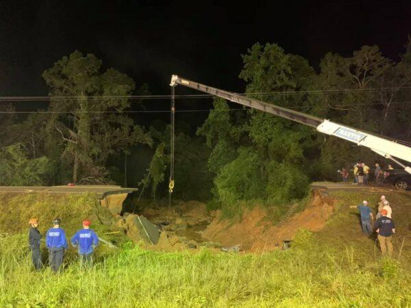 State troopers along with various other agencies at the scene of a road collapse on Highway 26 near Crossroads Road in George County, Miss., on Aug. 31, 2021. (Courtesy of Mississippi Highway Patrol)