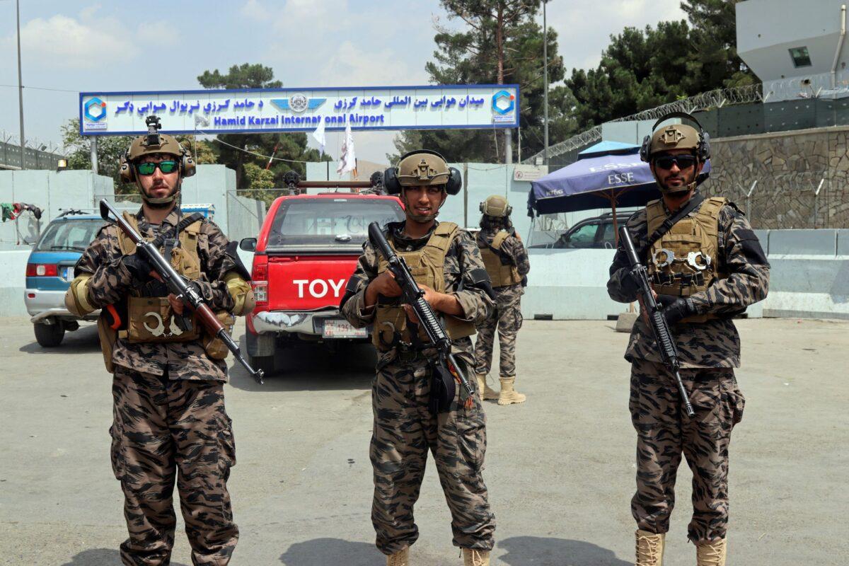 Taliban members stand guard outside the Hamid Karzai International Airport after the U.S. military's withdrawal, in Kabul, Afghanistan, on Aug. 31, 2021. (Khwaja Tawfiq Sediqi/AP Photo)