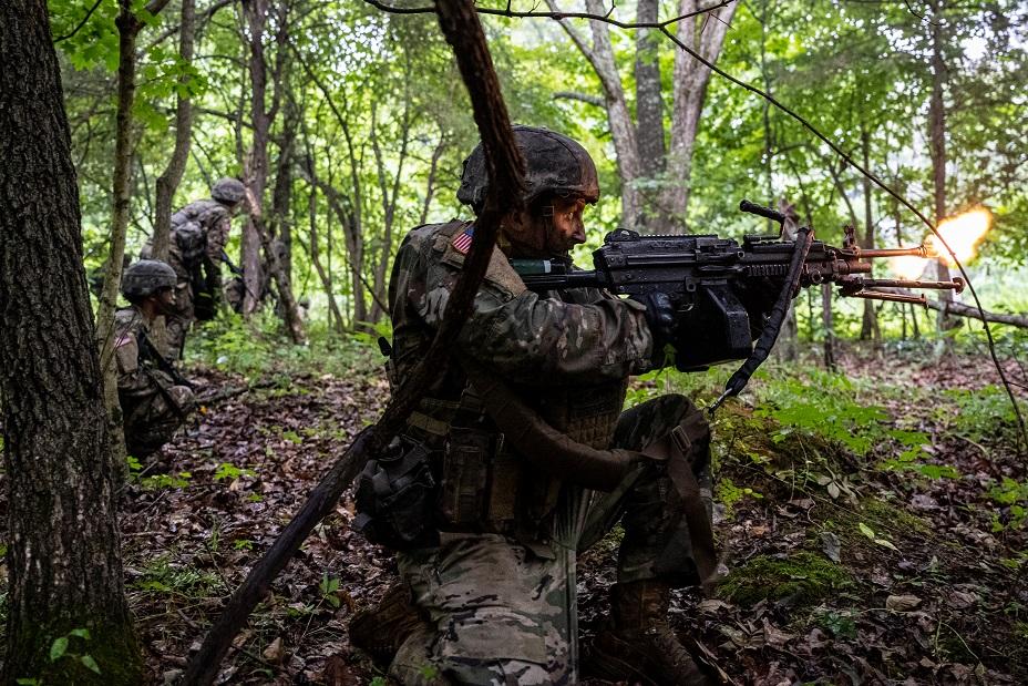 A cadet fires an M249 Squad Automatic Weapon (SAW) during Army ROTC Cadet Summer Training in Fort Knox, Ky., on July 1, 2021. (Jon Cherry/Getty Images)