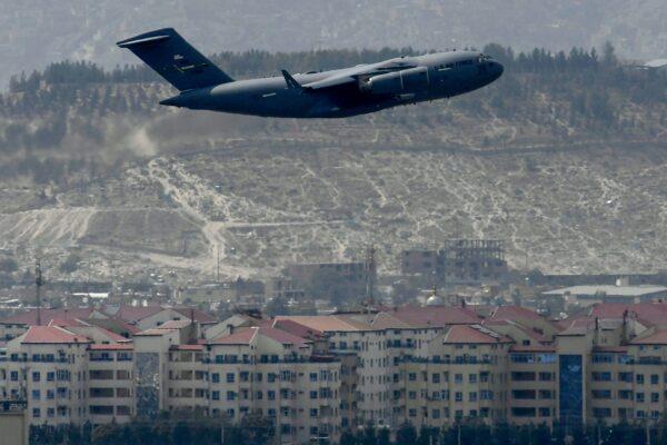 A U.S. Air Force aircraft takes off from the airport in Kabul on Aug. 30, 2021. Rockets were fired on Aug. 30 at Kabul's airport, where U.S. troops were racing to complete their withdrawal from Afghanistan and evacuate allies under the threat of attacks from ISIS terrorists. (Aamir Qureshi/AFP via Getty Images)