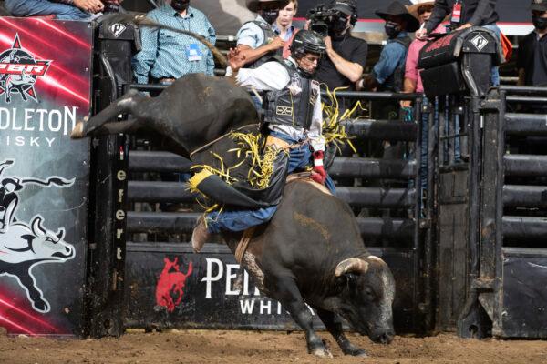 Amadeu Campos Silva rides the bull Yippee High Cowboy in Grand Rapids, Mich., in August 2021. (Andre Silva/Courtesy of PBR/Bull Stock Media via AP)