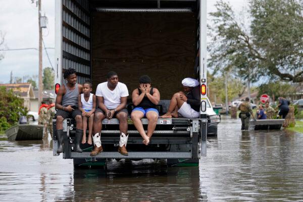 People are evacuated from floodwaters in the aftermath of Hurricane Ida in LaPlace, La., on Aug. 30, 2021. (Gerald Herbert/AP Photo)