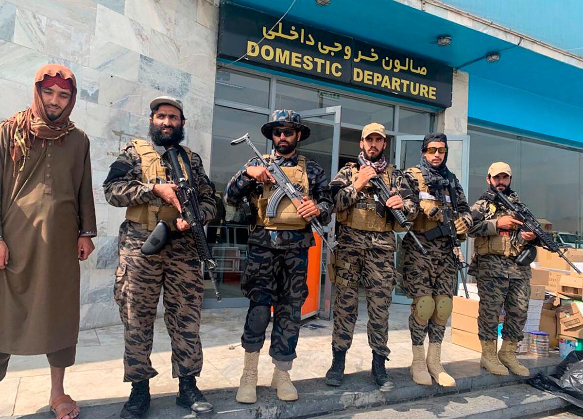 Taliban extremists stand guard inside the Hamid Karzai International Airport after the U.S. withdrawal in Kabul, Afghanistan on Aug. 31, 2021. (Kathy Gannon/AP Photo)