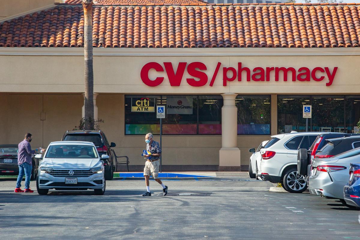 An elderly customer leaves a CVS Pharmacy in Irvine, California, on Feb. 11, 2021. (John Fredricks/The Epoch Times)