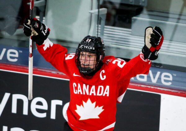 Canada's Marie-Philip Poulin celebrates her overtime goal against the United States during the IIHF hockey women's world championships title game in Calgary, Alberta, Canada, on Aug. 31, 2021. (Jeff McIntosh/The Canadian Press via AP)