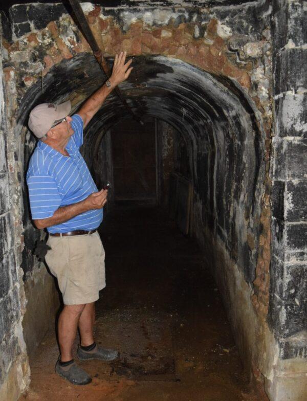 Lancaster County, Pennsylvania, farmer Luke Brubaker examines the brick arch of the cellar in his historic barn on Sept. 1, 2021. (Beth Brelje/The Epoch Times)