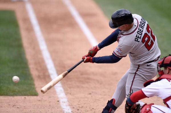 Joc Pederson #22 of the Atlanta Braves hits a single in the fifth inning against the Washington Nationals at Nationals Park in Washington on Aug. 15, 2021. (Greg Fiume/Getty Images)