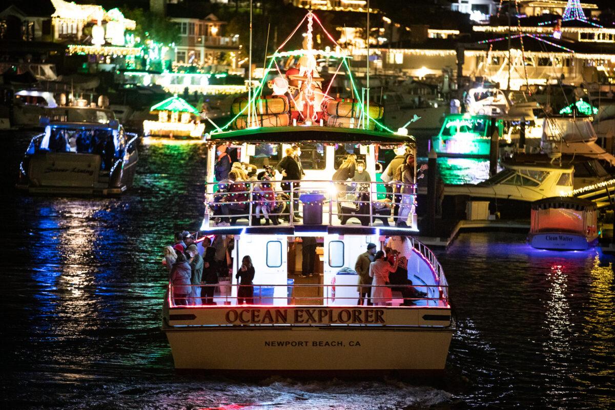 Boats show off Christmas decorations in Newport Harbor, Newport Beach, Calif., on Dec. 17, 2020. (John Fredricks/The Epoch Times)