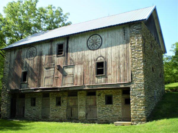 Historic barn with painted hex signs decorating the wall in Lehigh County, Pa. (Greg Huber)