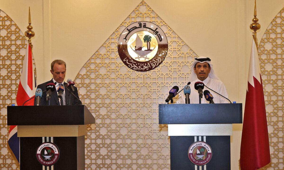 Britain's Foreign Secretary Dominic Raab (L) and his Qatari counterpart Sheikh Mohammed bin Abdulrahman al-Thani give a joint press conference in Doha, Qatar on Sept. 2, 2021. (Karim Jaafar/AFP via Getty Images)