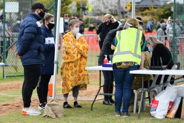 People wait in line to receive their COVID-19 vaccines at a newly opened vaccination hub in Dubbo, NSW, Australia, on Aug. 21, 2021. (Belinda Soole/Getty Images)