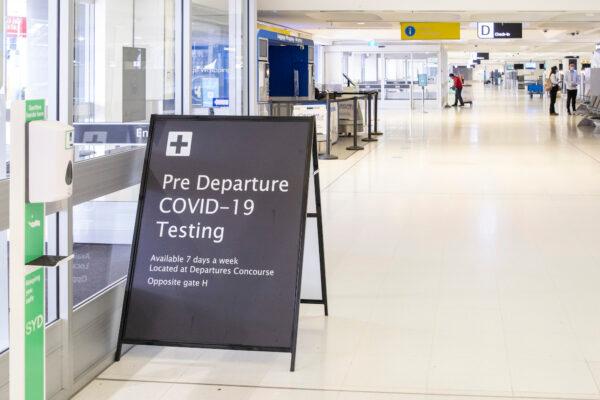 A COVID-19 testing sign is seen at Sydney International airport in Sydney, Australia, on June 23, 2021. (Jenny Evans/Getty Images)