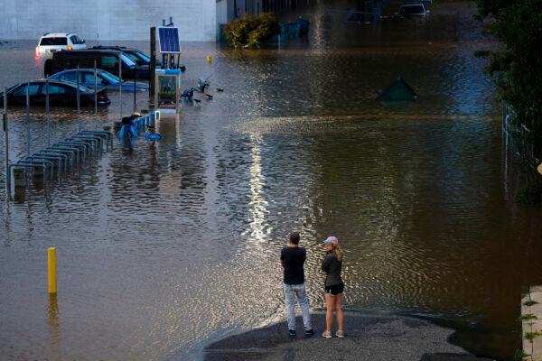 People view a flooded street in Philadelphia, Pa., on Sept. 2, 2021. (Matt Rourke/AP Photo)