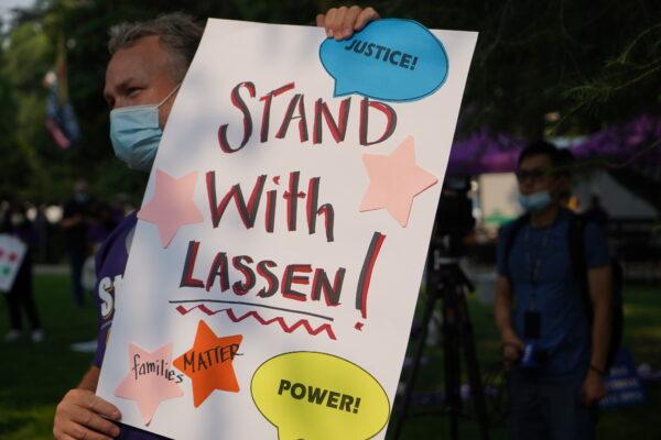 A protester holds a sign supporting Lassen County during a rally in Sacramento, Calif., on Aug. 27, 2021. (Cynthia Cai/The Epoch Times)