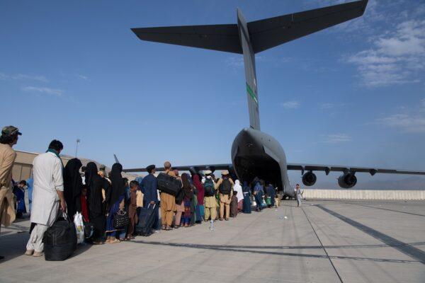 Passengers board a U.S. Air Force C-17 as part of the evacuation from Afghanistan at Hamid Karzai International Airport in Kabul, on Aug. 24, 2021. (Master Sgt. Donald R. Allen/U.S. Air Forces Europe-Africa via Getty Images)