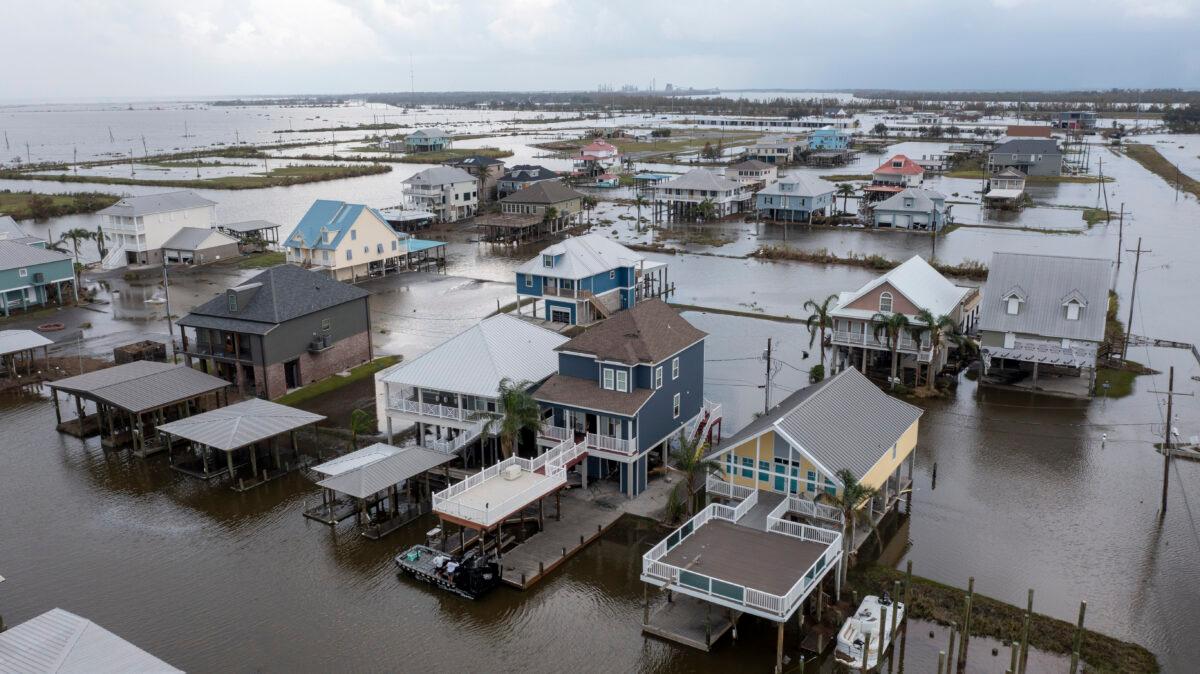 Flood waters still surround homes as residents try to recover from the effects of Hurricane Ida in Myrtle Grove, La., on Sept. 1, 2021 (Steve Helber/AP Photo)