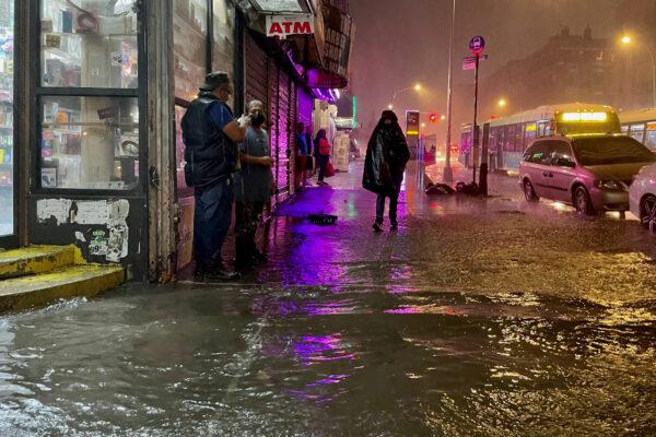 People make their way in rainfall from the remnants of Hurricane Ida in the Bronx borough of New York City on Sept. 1, 2021. (David Dee Delgado/Getty Images)