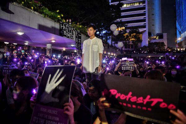 Hong Kong Cantopop singer Denise Ho poses for a photograph with protesters during a rally calling on the Hong Kong police to answer accusations of sexual violence against pro-democracy protesters in Hong Kong on Aug. 28, 2019. (Lillian Suwanrumpha/AFP)