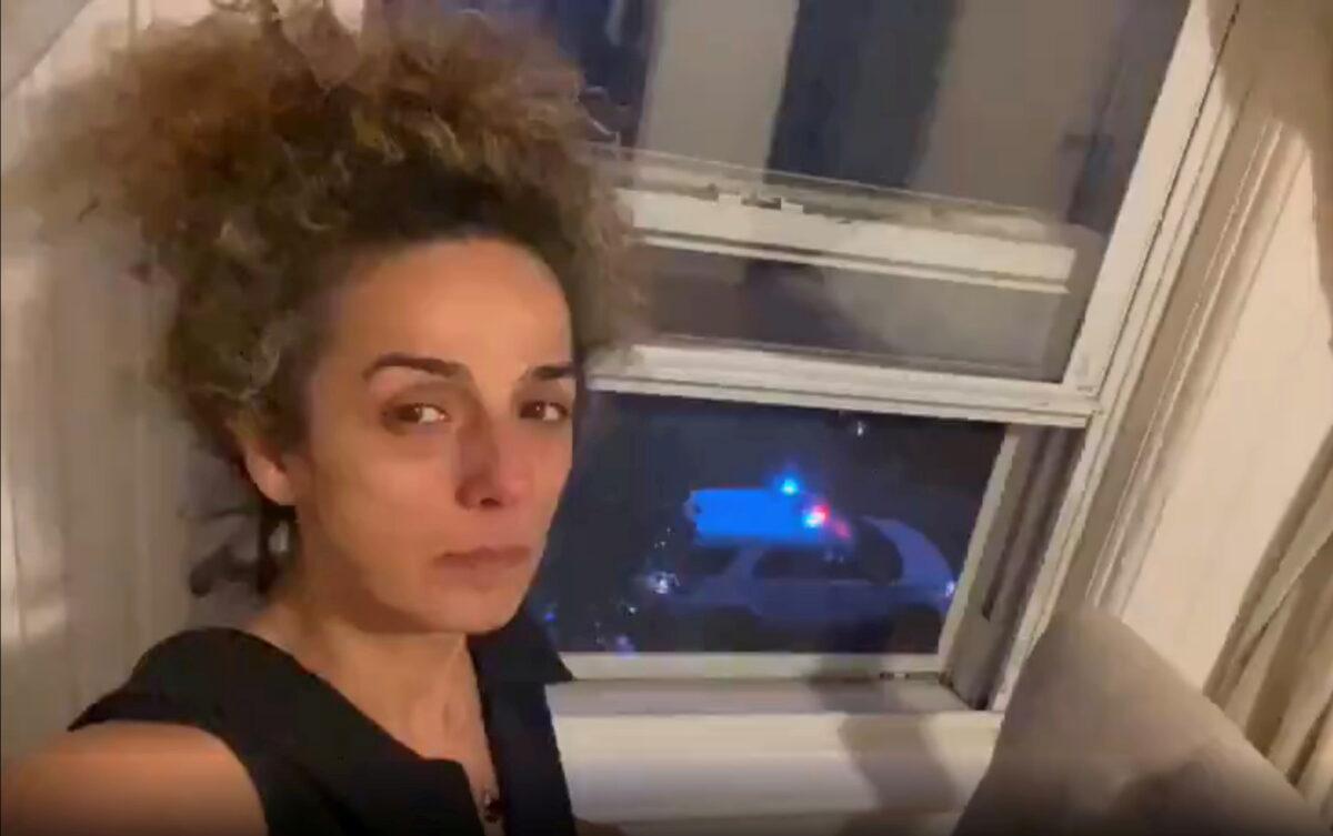 Iranian American journalist Alinejad Masih shows an FBI car guarding outside her apartment in this still image from an undated social media video posted on July 14, 2021. (Twitter/@AlinejadMasih/via Reuters)