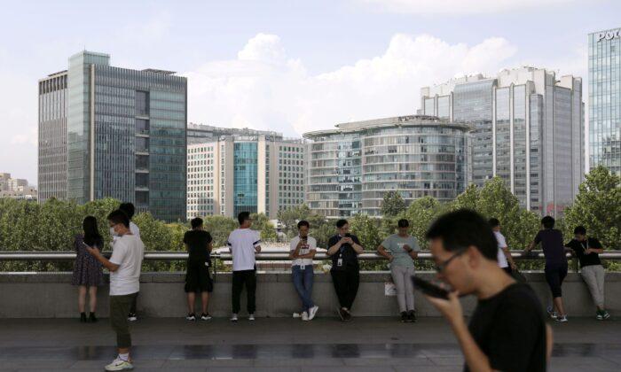 Not My Pay! Some Tech Workers Bemoan China’s Crackdown on Compulsory Overtime