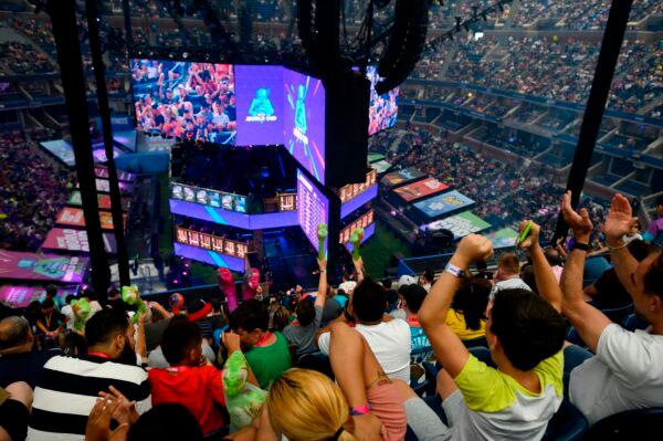 Fans cheer during the final of the Solo competition at the 2019 Fortnite World Cup inside Arthur Ashe Stadium, in New York City, on July 28, 2019. (Johannes Eisele/AFP via Getty Images)